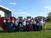 participants by the I love UG sign