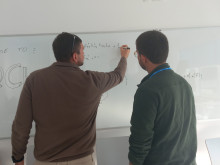 Nicola Lo Gullo explains something on the whiteboard